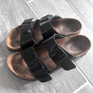 Birkenstock black patent Arizona sandals, regular footbed.